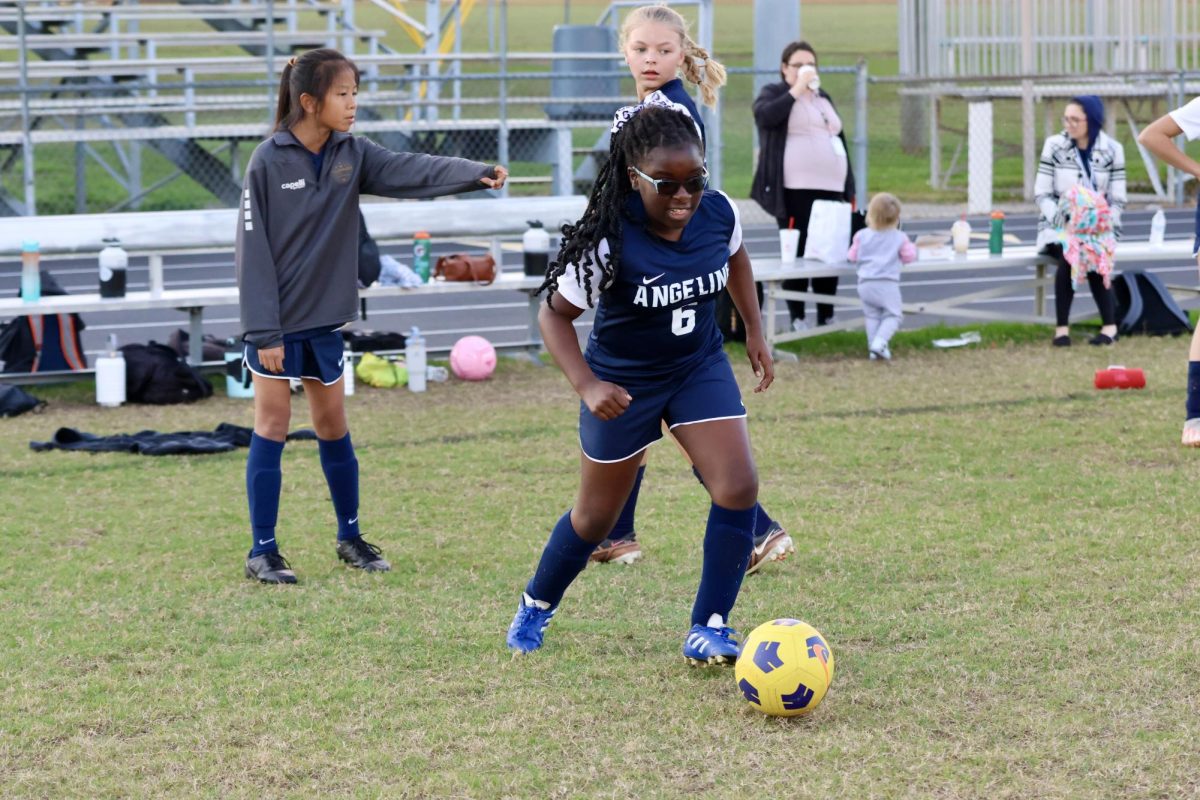 Samarah Kirbby warms up with some passing drills before the game.