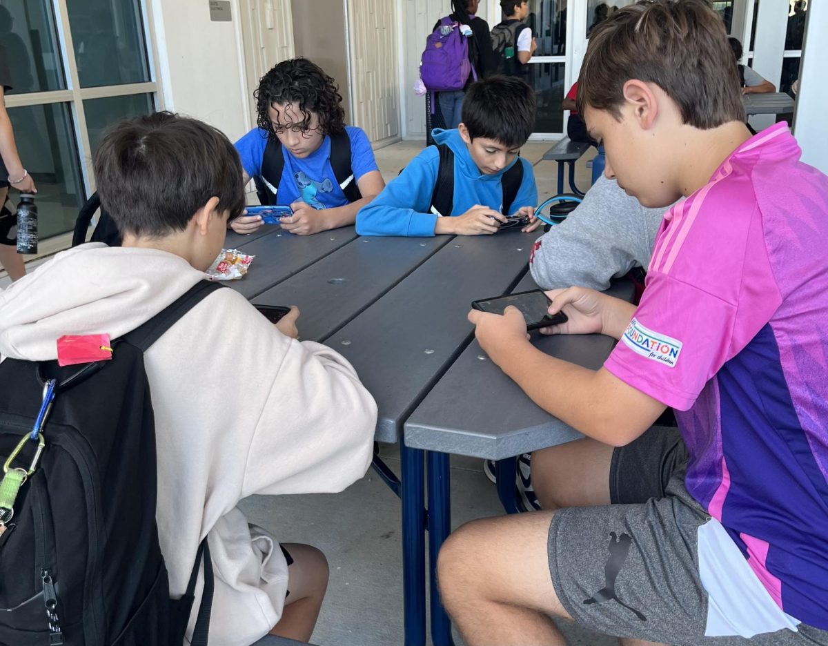 Students at Angeline Academy are playing Brawl Stars before school with friends. John-Kural Diamond, Grayson Geisler, Luis Vicens Hernandez, Martin Garzon Barbosa.